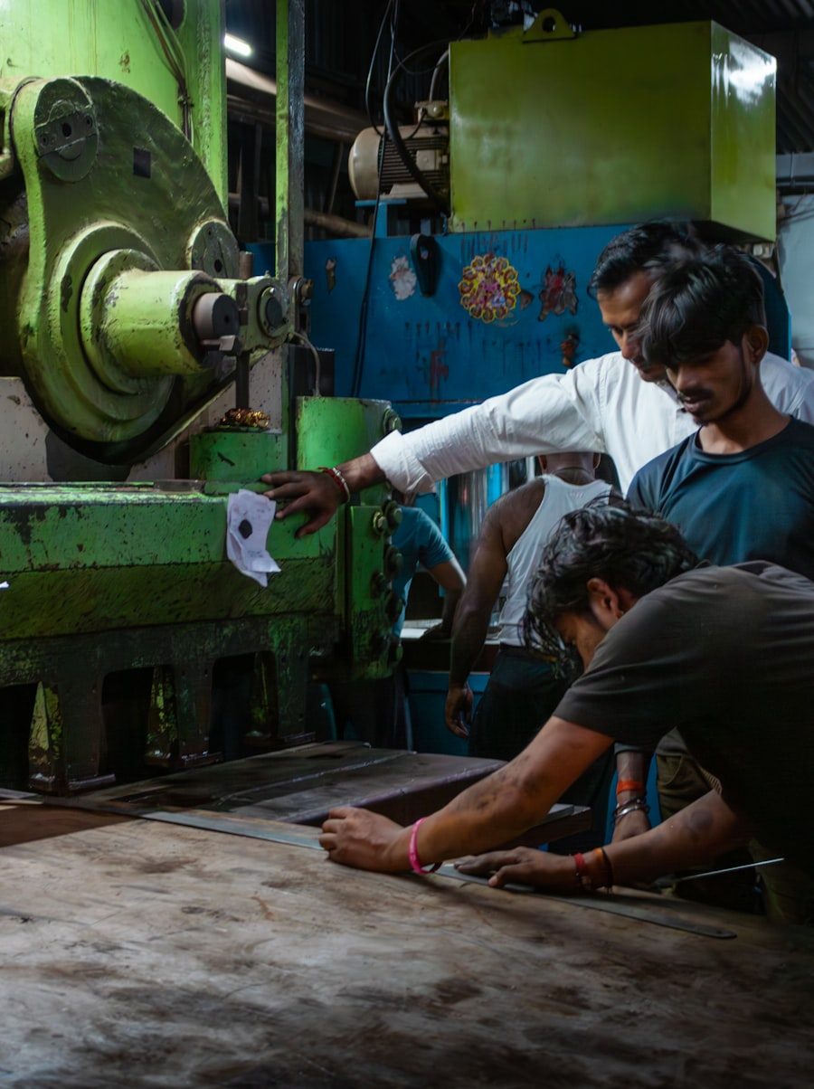 Workers operating machinery on a factory production floor